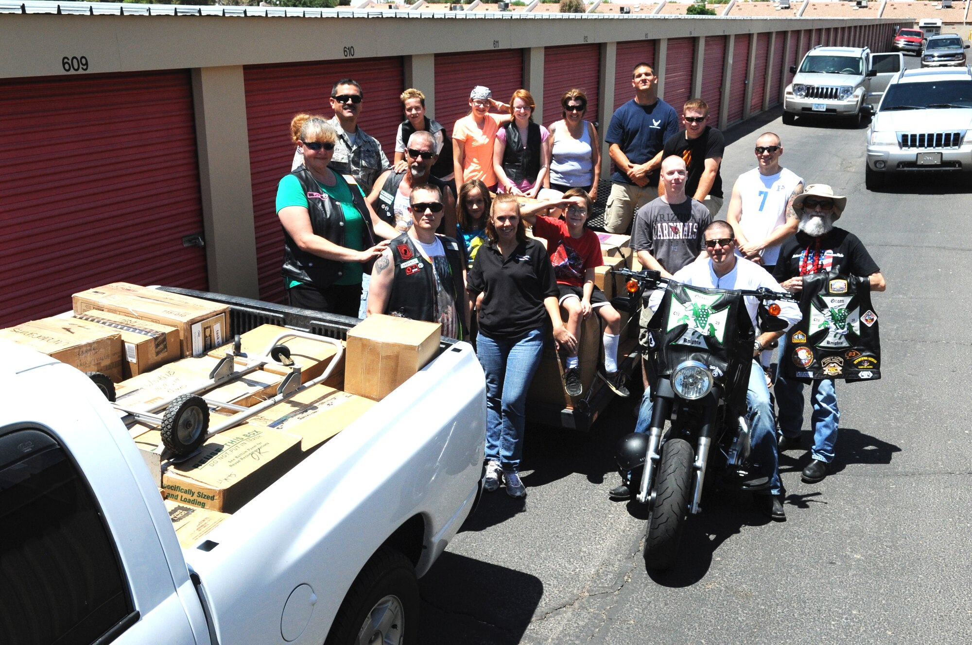 Thunderbolts and members of the Green Knights Military Motorcycle Club take a break after packing uniforms. (U.S. Air Force photo by Staff Sgt. Nestor Cruz)