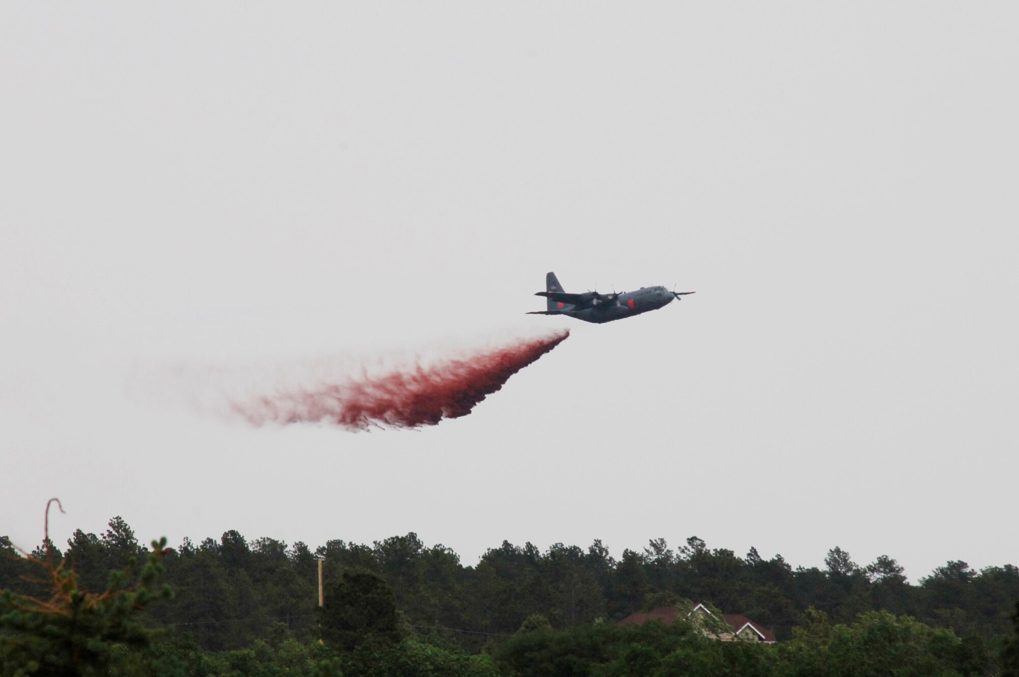 A Modular Airborne Firefighting System-equipped C-130s from the 302nd Airlift Wing is providing firefighting assistance to civil authorities at the Black Forest fire in El Paso County, Colo., June 12, 2013. (U.S. Air Force photo by Senior Airman Kendra Alba)