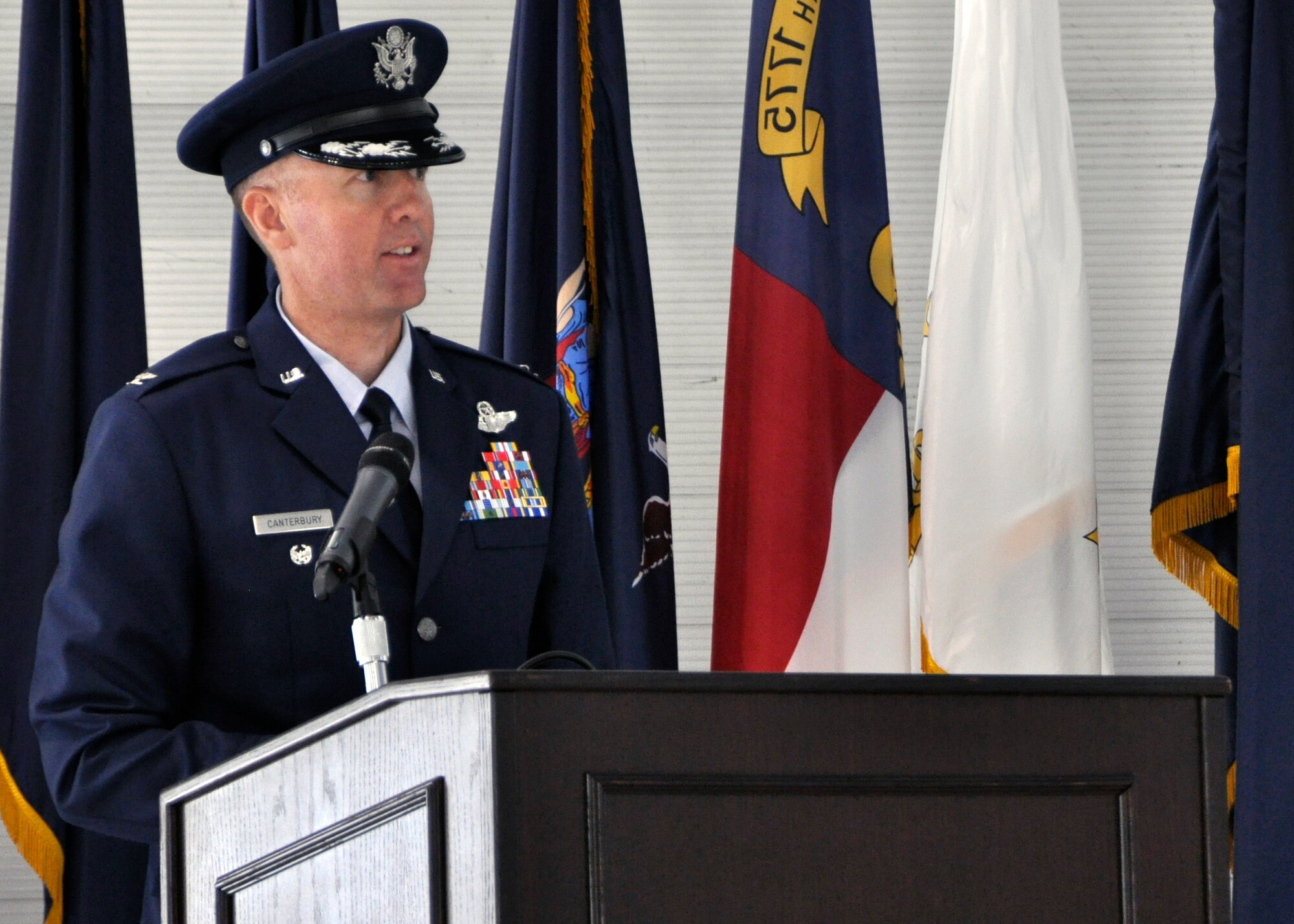 Col. Todd Canterbury speaks to the 33rd Fighter Wing for the first time as its commander during the wing's change of command ceremony June 14 at Eglin Air Force Base, Fla. Canterbury took command of the wing from Col. Andrew Toth, who leaves to become director of assignments at Joint Base San Antonio-Randolph, Texas. (U.S. Air Force Photo/Sara Vidoni)