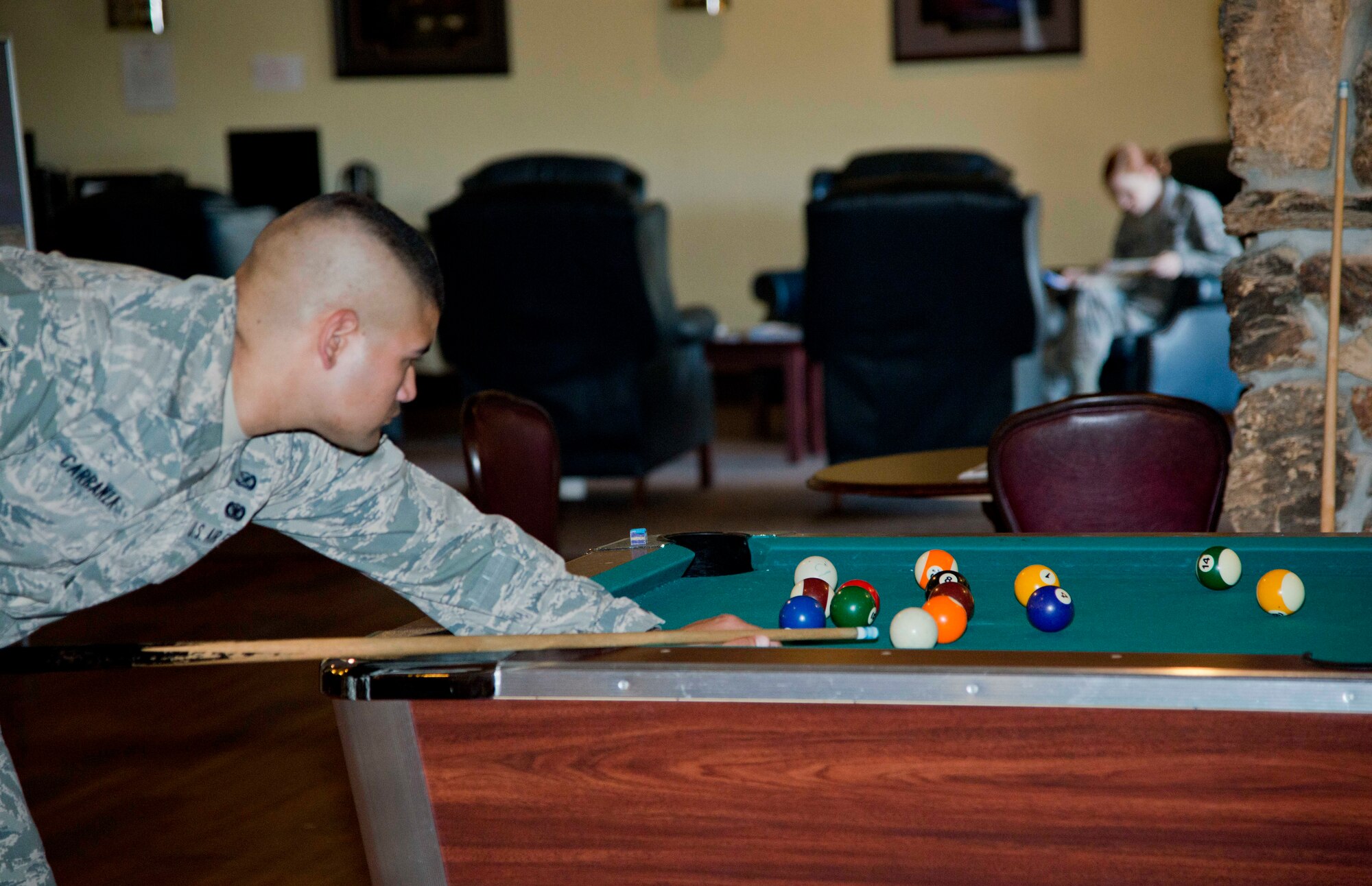 Airmen hangh out at the USO after the duty day June 12. Airmen and their families have full access to pingpong, air hockey and pool tables. (U.S. Air Force photo/Airman 1st Class Nicole Leidholm)