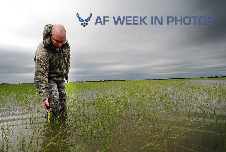 Staff Sgt. Timothy Cole conducts a rainwater assessment May 31, 2013, at Whiteman Air Force Base, Mo. The rainwater assessments are part of a daily inspection airfield managers complete at least 12 times a day. The safety of Whiteman AFB’s airfield depends on the expertise of airfield managers. Cole is an airfield management operations supervisor assigned to the 509th Operations Support Squadron. (U.S. Air Force photo by Staff Sgt. Nick Wilson)
