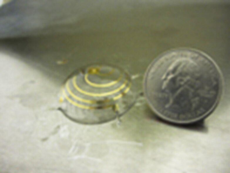 The hemisphere-shaped antenna developed at the University of Michigan could result in small conformal antennas integrated onto the surface of Micro-Air Vehicles.  (Graphic: Grbic/University of Michigan)