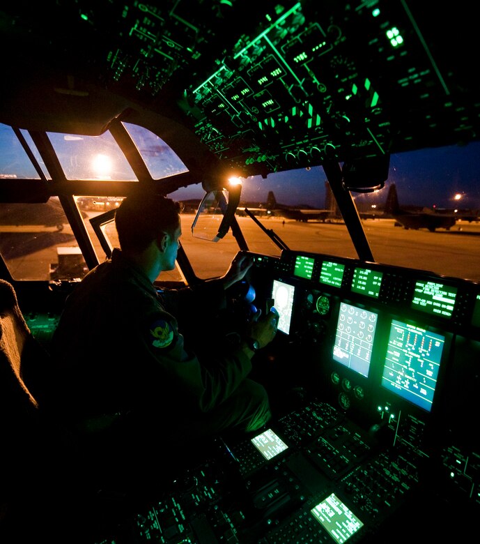 Capt. Jonathan Ferricher prepares a C-130J for flight June 4, 2013, at Dyess Air Force Base, Texas. The Denton Amendment allows U.S. military aircraft to transport, on a space-available basis, humanitarian supplies from nongovernment organizations to people around the world who are in need of assistance. The 317th Airlift Group transported the supplies to Pope Army Airfield, N.C., where it will be taken to Joint Base Charleston, S.C., and then to Afghanistan. Ferricher is assigned to the 39th Airlift Squadron. (U.S. Air Force photo/Senior Airman Jonathan Stefanko)