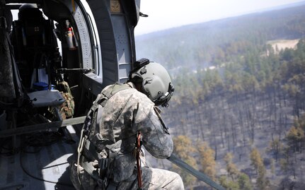 The crew of a UH-60 Black Hawk helicopter surveys the Black Forest Fire June 13, 2013. The crew is assigned to the 4th Combat Aviation Brigade, 4th Infantry Division, at Fort Carson, Colo. (U.S. Air Force photo/Capt. Richard Ricciardi)