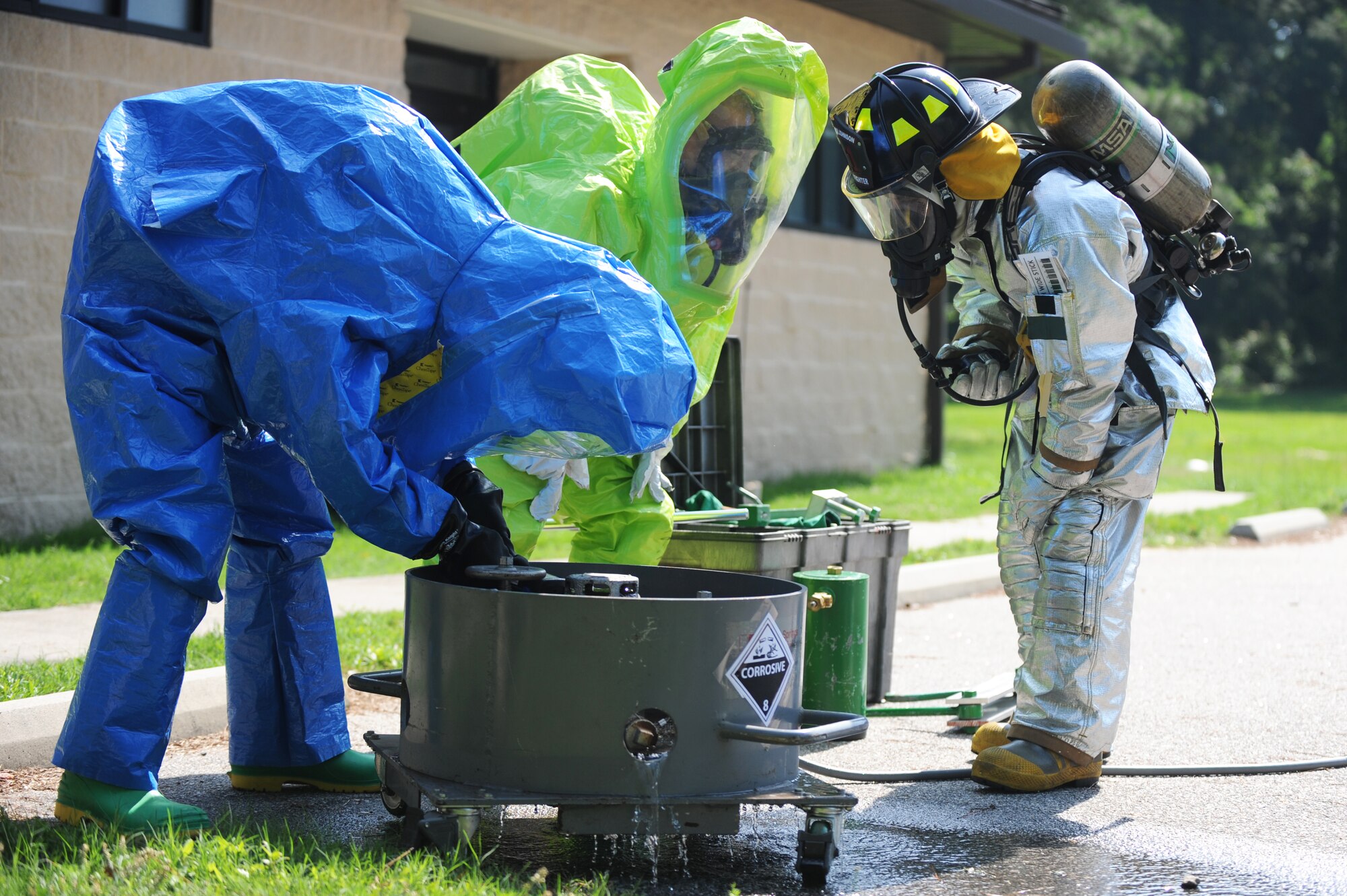 U.S. Air Force Airmen assigned to the 4th Civil Engineer and Aerospace Medicine Squadrons inspect a leak on a simulated railcar during an exercise at Seymour Johnson Air Force Base, N.C., June 13, 2013.  The Airmen check the valves’ pressure to see if the leak could be stopped before applying a patch kit.  (U.S. Air Force photo by Airman 1st Class Brittain Crolley/Released)