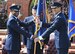 Lt. Gen. Darren McDew, 18th Air Force commander, presents the 375th Air Mobility Wing flag to Col. Kyle Kremer signifying the start of Kremer's command of the wing during a ceremony June 14 at Scott Air Force Base, Ill. Kremer arrived from McConnell Air Force Base, Kan., where he served as the vice commander of the 22nd Air Refueling Wing. (U.S. Air Force photo/Airman Kristina Forst)