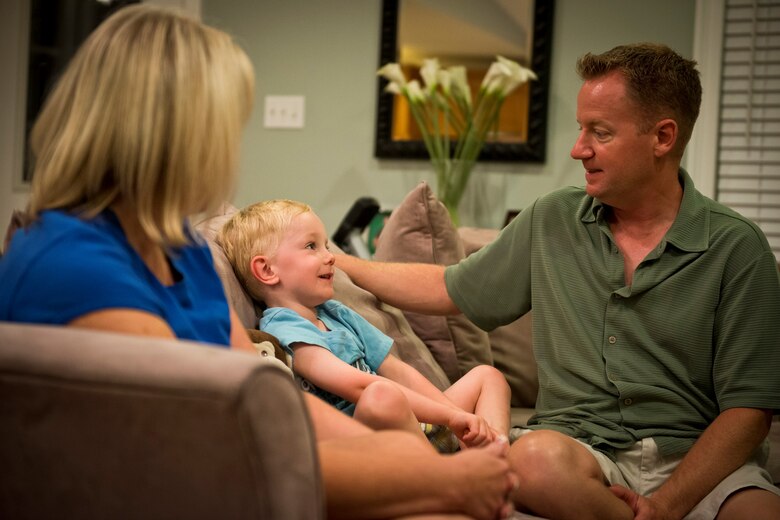 Maj. Sean Cross with his wife, Apryl, and son Cooper. Cross is one of the hurricane hunter pilots with the 53rd Weather Reconnaissance Squadron at Keesler Air Force Base, Miss. Cross and his crew often find themselves, as well as their families, in harms way during hurricane season on the Gulf of Mexico. (Photo courtesy Maj. Sean Cross)