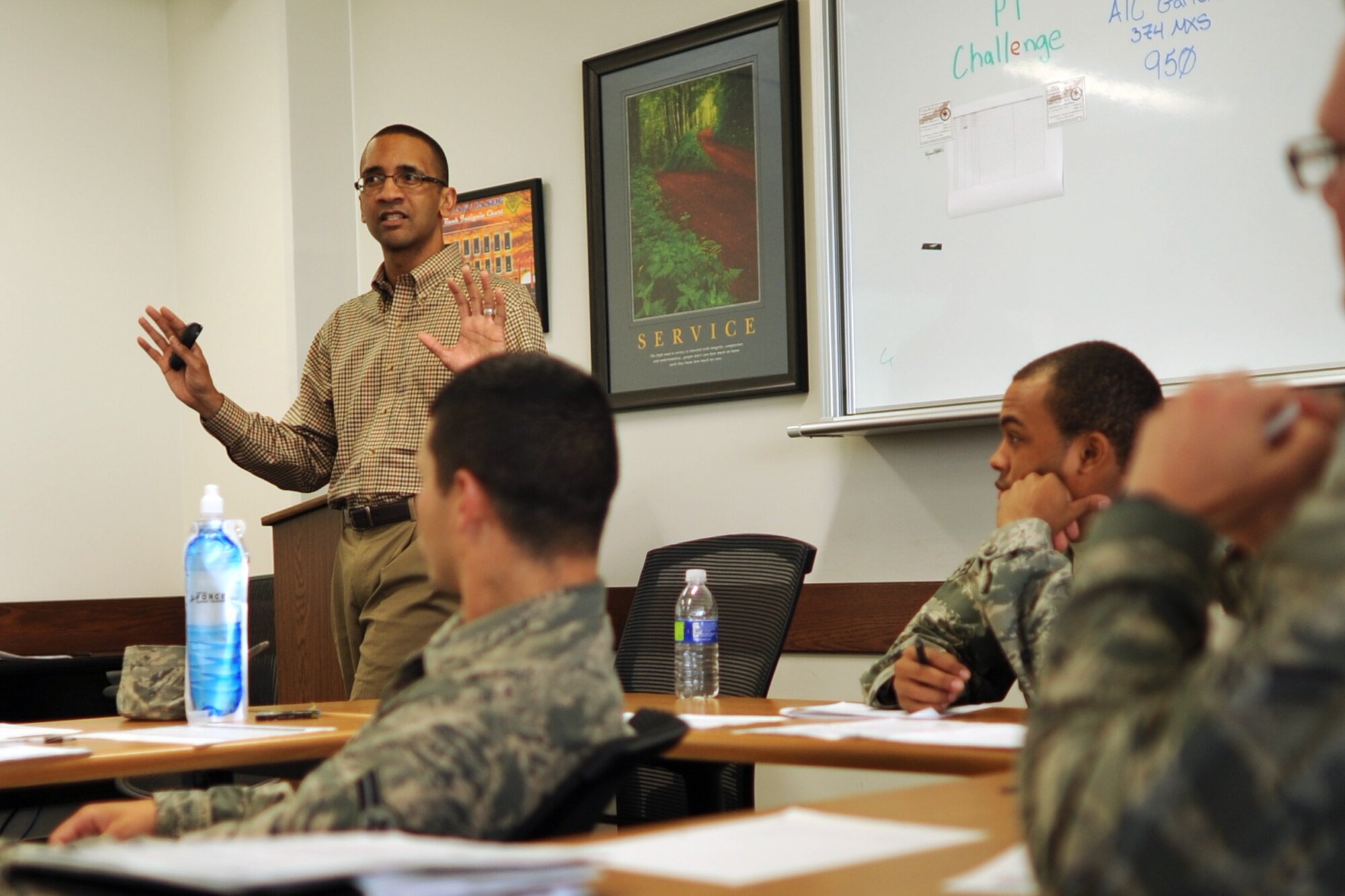 YOKOTA AIR BASE, Japan -- Ron Draper, 374th Airlift Wing community support coordinator, talks to Airmen about resiliency June 14, 2013, at Yokota Air Base, Japan. The interactive resiliency training is currently offered to Airmen attending class at the First Term Airman Center. However, Draper hopes to provide this training to everyone in the Yokota community (U.S. Air Force photo by Senior Airman Desiree Economides)