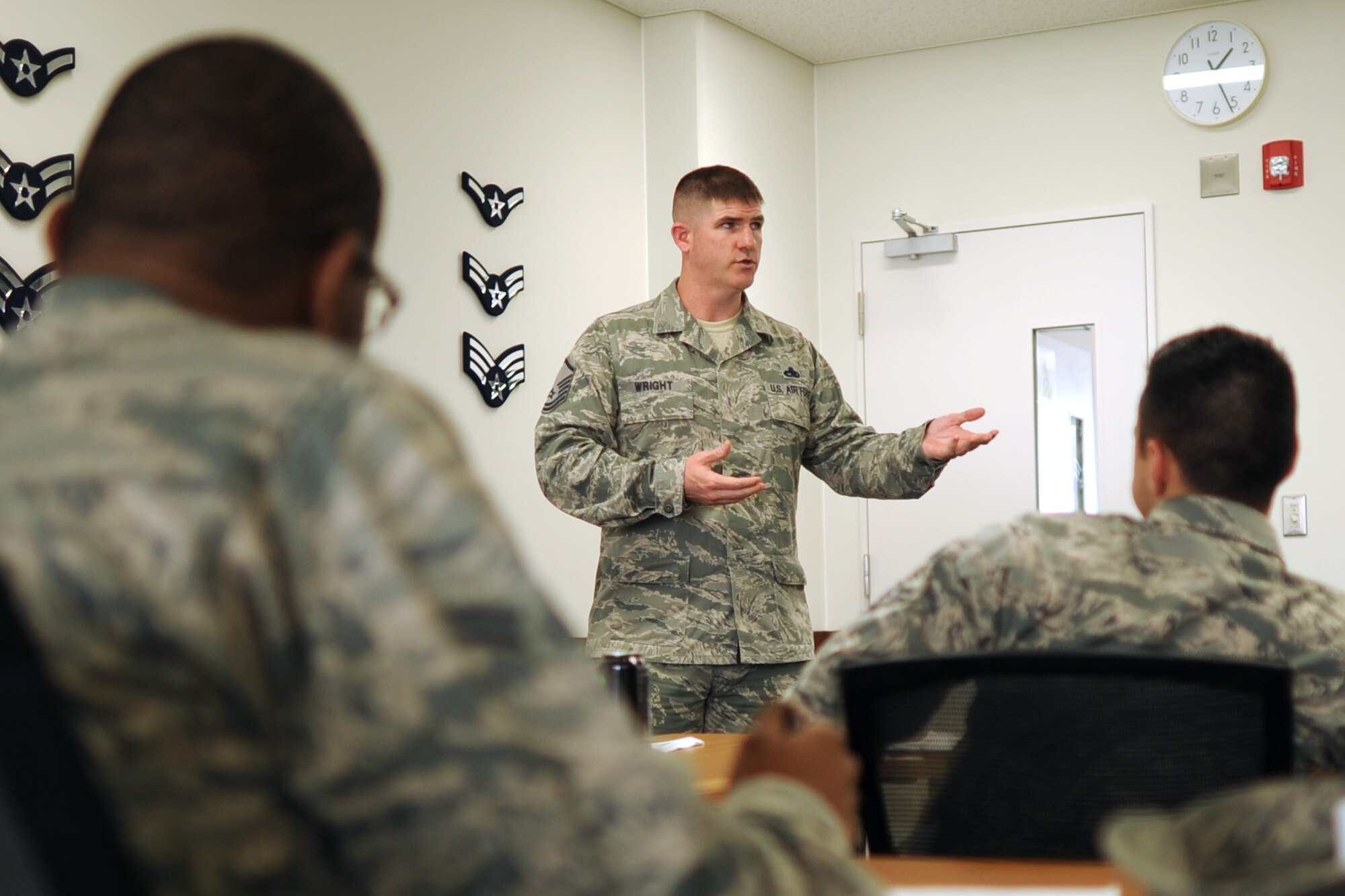 YOKOTA AIR BASE, Japan -- Master Sgt. Adam Wright, a master resiliency trainer for the 374th Airlift Wing, talks to Airman about resiliency at the First Term Airmen Center June 14, 2013, at Yokota Air Base, Japan. During the mandatory eight-hour course, Airmen learn skills aimed to prepare them to handle daily life as well as unexpected major events. (U.S. Air Force photo by Senior Airman Desiree Economides)