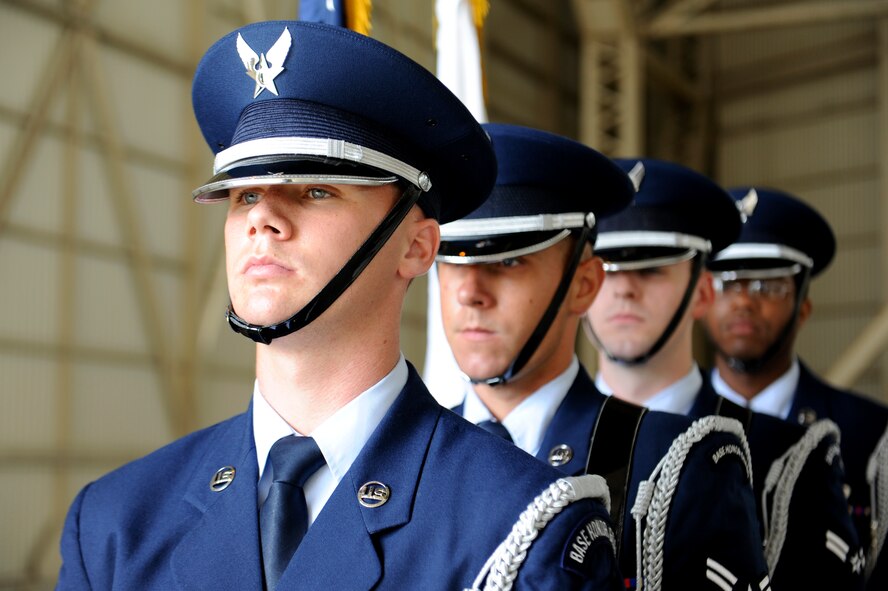 Kadena honor guard members prepare to present the colors at the 909th Air Refueling Squadron change of command on Kadena Air Base, Japan, June 14, 2013. The incoming commander, U.S. Air Force Lt. Col. Jack Flynt III, 909th ARS commander, is a senior pilot with more than 3,400 flying hours. The 909th ARS mission statement is to execute unmatched air refueling, aeromedical evacuation, and combat support during global contingencies and peacetime operations through the sustained employment and development of professional combat-ready Airmen. (U.S. Air Force photo by Airman 1st Class Malia Jenkins/Released)