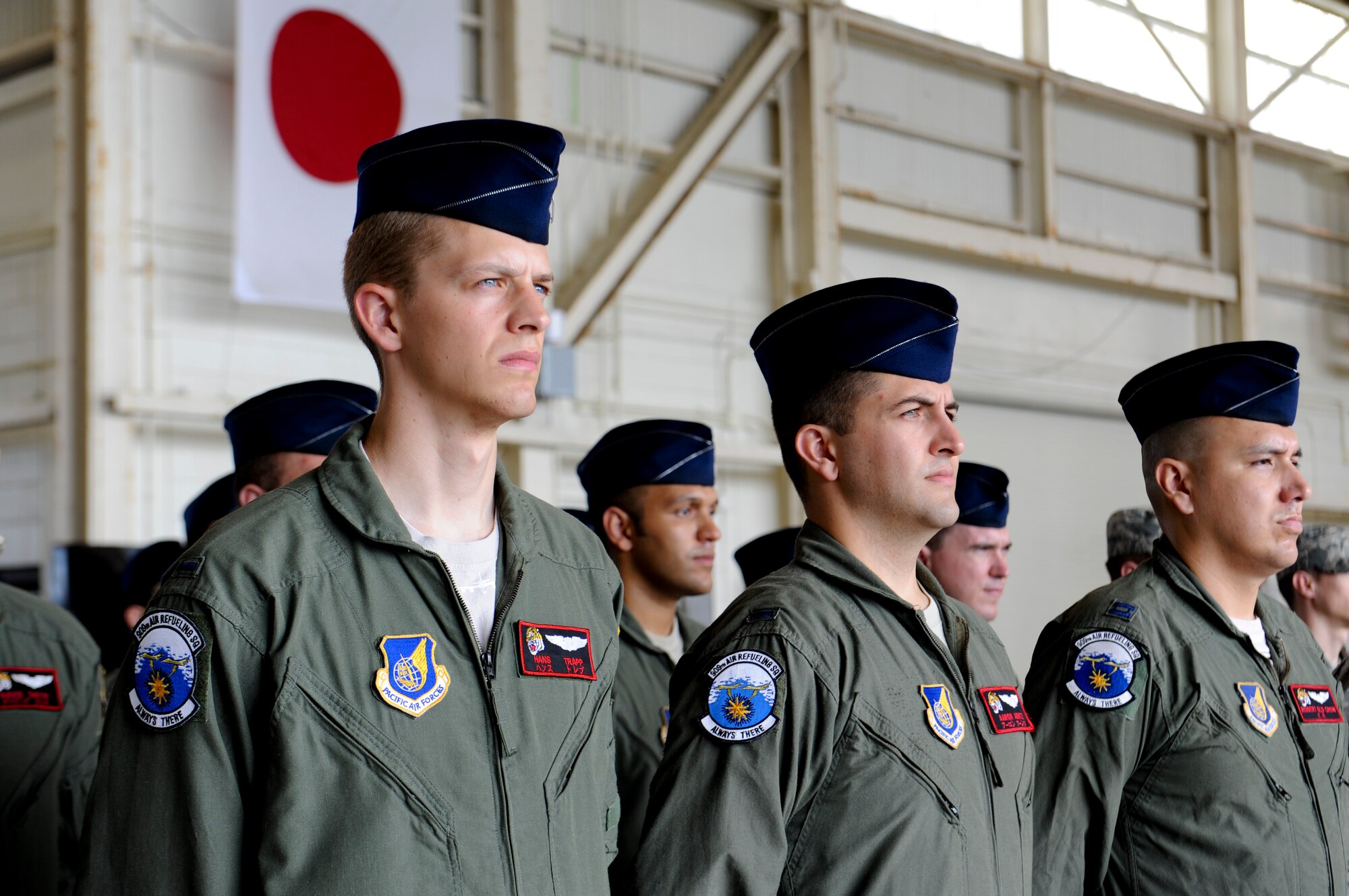 Members from the 909th Air Refueling Squadron stand in formation at the 909th ARS change of command ceremony on Kadena Air Base, Japan, June 14, 2013. The 909th ARS mission statement is to execute unmatched air refueling, aeromedical evacuation, and combat support during global contingencies and peacetime operations through the sustained employment and development of professional combat-ready Airmen. (U.S. Air Force photo by Airman 1st Class Malia Jenkins/Released)