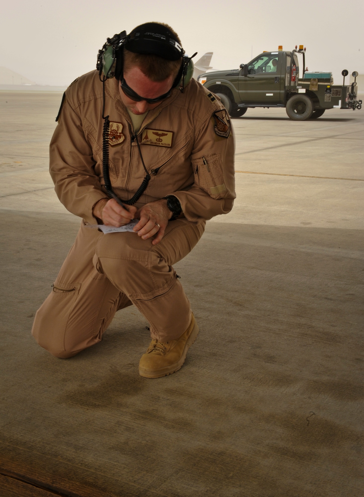 Capt. Brandon Packard performs pre-flight checks of a B-1B Lancer June 11, 2013, at the 379th Air Expeditionary Wing in Southwest Asia. Packard is a 34th Expeditionary Bomb Squadron weapons systems officer deployed from Ellsworth Air Force Base, S.D. (U.S. Air Force photo/Senior Airman Benjamin Stratton)