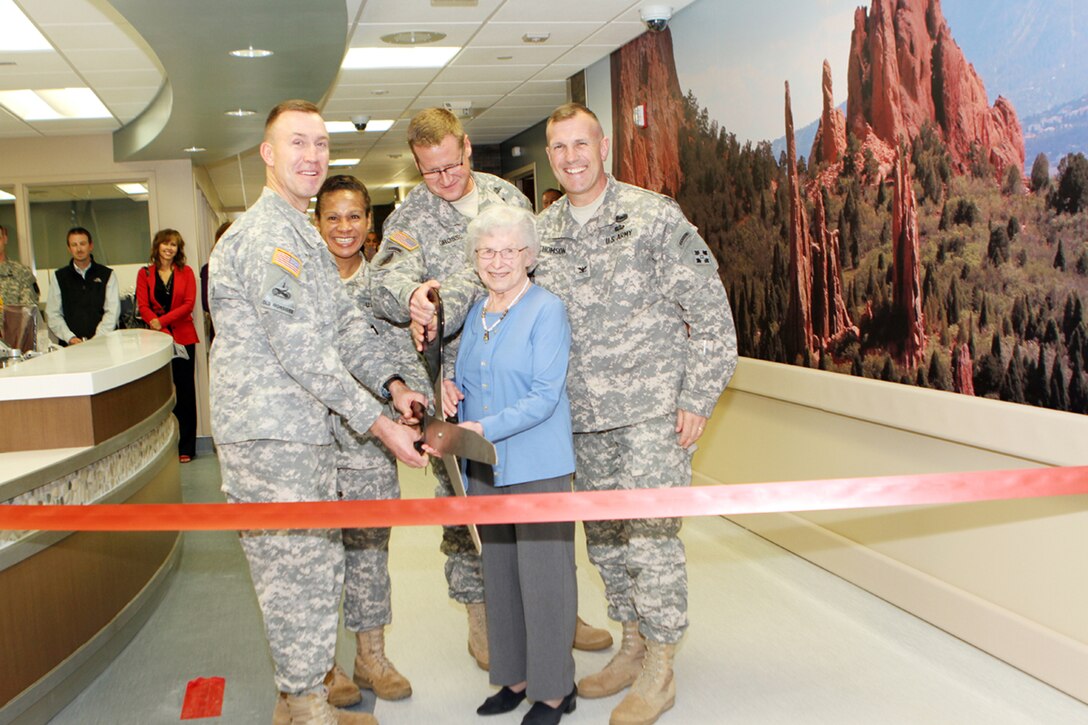 Col. John McGrath (MEDDAC commander), CSM Donna Brock (MEDCOM CSM and Senior Enlisted Advisor to the Surgeon General), Fort Carson Commander Col. David Grasso, Mrs. Ella Cochrane (spouse of former Evans commander Col. Gharles Cochrane) and Col. John Thomson (Deputy Commander 4th Infantry Division) cut the ribbon to officially open the Evans Army Community Hospital's Family Care Ward.