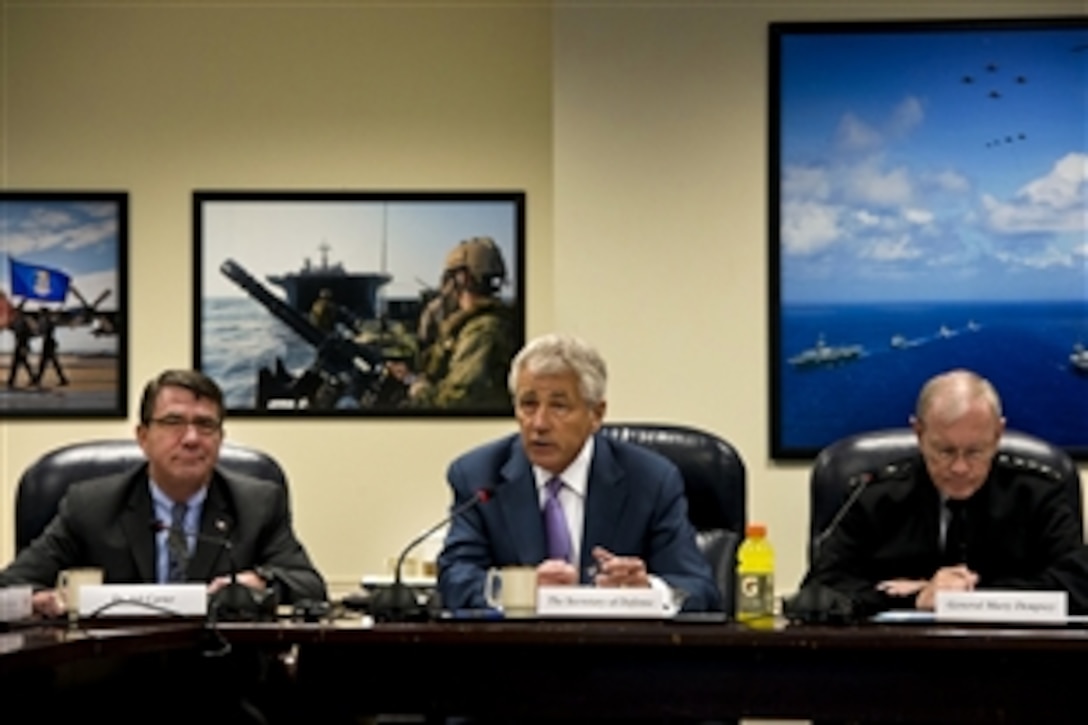 Defense Secretary Chuck Hagel, center, Deputy Secretary of Defense Ash Carter, left, and Army Gen. Martin E. Dempsey, chairman of the Joint Chiefs of Staff, meet with senior Defense Department and combatant commanders at the Pentagon, June 14, 2013. 