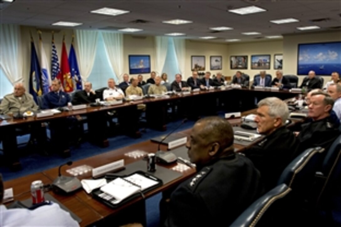 Defense Secretary Chuck Hagel, not shown, hosts White House Chief of Staff Denis McDonough during a Senior Leadership Council meeting with senior Defense Department leaders and combatant commanders at the Pentagon, June 14, 2013. 