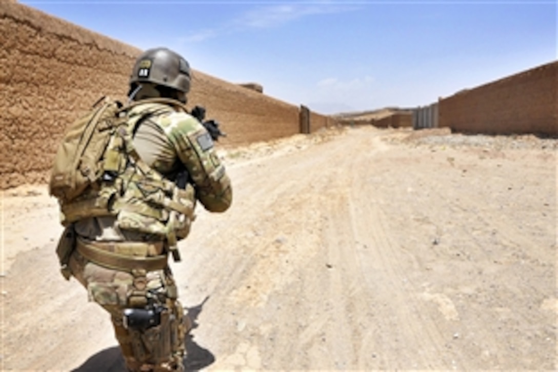 U.S. Army Sgt. Oscar Lagunas provides security and keeps watch on a road during a logistics inspection in Tarin Kot, Uruzgan province, Afghanistan, June 4, 2013. Lagunas is assigned to the Security Force Assistance Team, 56th Infantry Brigade Combat Team. 