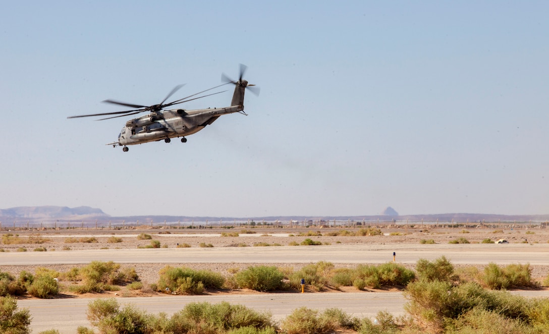 A CH-53E Super Stallion assigned to Marine Medium Tiltrotor Squadron (VMM) 266 (Reinforced), takes off from King Faisal Air Base in Jordan, June 11, 2013. Exercise Eager Lion 2013 is an annual, multinational exercise designed to strengthen military-to-military relationships and enhance security and stability in the region by responding to modern-day security scenarios. The 26th MEU is a Marine Air-Ground Task Force forward-deployed to the U.S. 5th Fleet area of responsibility aboard the Kearsarge Amphibious Ready Group serving as a sea-based, expeditionary crisis response force capable of conducting amphibious operations across the full range of military operations. (U.S. Marine Corps photograph by Sgt. Christopher Q. Stone, 26th MEU Combat Camera/Released)