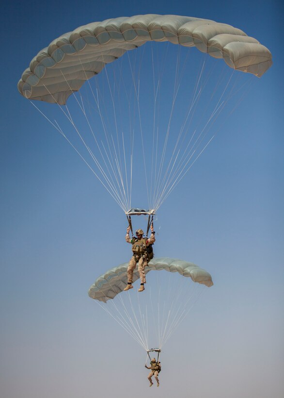 26th Marine Expeditionary Unit (MEU) Maritime Raid Force Marines navigate their way to a landing zone during parachute operations at King Faisal Air Base in Jordan, June 12, 2013. Exercise Eager Lion 2013 is an annual, multinational exercise designed to strengthen military-to-military relationships and enhance security and stability in the region by responding to modern-day security scenarios. The 26th MEU is a Marine Air-Ground Task Force forward-deployed to the U.S. 5th Fleet area of responsibility aboard the Kearsarge Amphibious Ready Group serving as a sea-based, expeditionary crisis response force capable of conducting amphibious operations across the full range of military operations. (U.S. Marine Corps photograph by Sgt. Christopher Q. Stone, 26th MEU Combat Camera/Released)