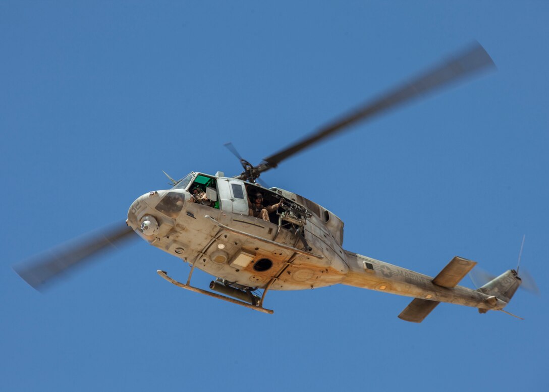 A UH-1N Huey assigned to Marine Medium Tiltrotor Squadron (VMM) 266 (Reinforced), flies over King Faisal Air Base in Jordan, June 12, 2013. Exercise Eager Lion 2013 is an annual, multinational exercise designed to strengthen military-to-military relationships and enhance security and stability in the region by responding to modern-day security scenarios. The 26th MEU is a Marine Air-Ground Task Force forward-deployed to the U.S. 5th Fleet area of responsibility aboard the Kearsarge Amphibious Ready Group serving as a sea-based, expeditionary crisis response force capable of conducting amphibious operations across the full range of military operations. (U.S. Marine Corps photograph by Sgt. Christopher Q. Stone, 26th MEU Combat Camera/Released)