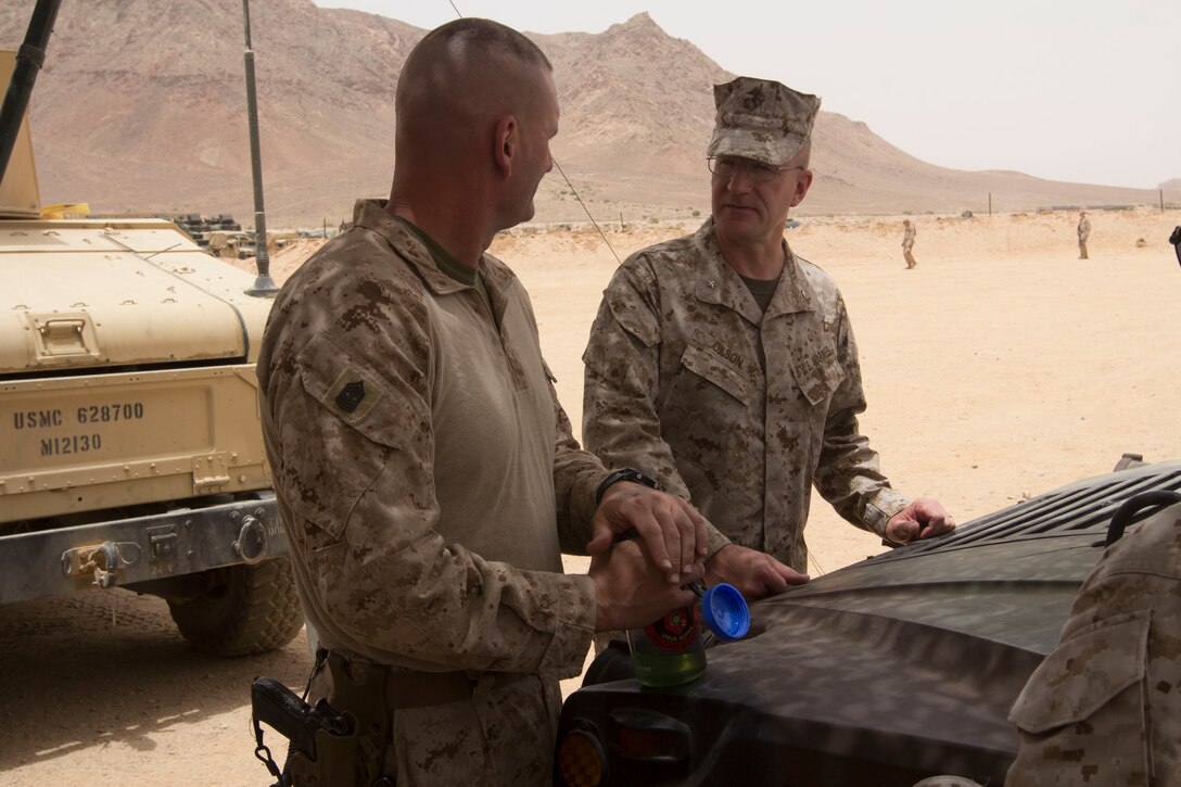 Brig. Gen. Gregg P. Olsen, U.S. Marine Corps Forces Central Command Forward, discusses Exercise Eager Lion 2013 with Sgt. Maj. James S. Moran, sergeant major for Battalion Landing Team 3/2, 26th Marine Expeditionary Unit (MEU), aboard Al Quweira, Jordan, June 8, 2013. Exercise Eager Lion 2013 is an annual multinational exercise designed to strengthen military-to-military relationships and enhance security and stability in the region by responding to modern-day security scenarios. The 26th MEU is a Marine Air-Ground Task Force forward-deployed to the U.S. 5th Fleet area of responsibility aboard the Kearsarge Amphibious Ready Group serving as a sea-based, expeditionary crisis response force capable of conducting amphibious operations across the full range of military operations. (U.S. Marine Corps photo by Cpl. Kyle N. Runnels/Released)