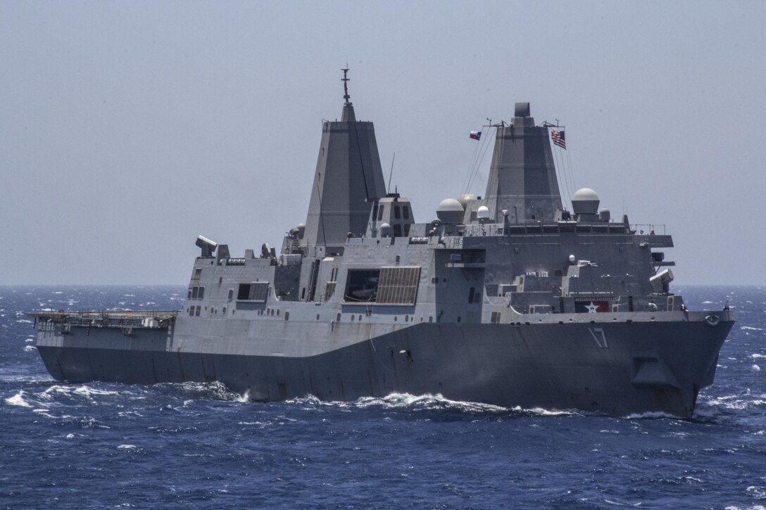 The USS San Antonio (LPD 17) sails at sea, June 16, 2013. The 26th MEU is a Marine Air-Ground Task Force forward-deployed to the U.S. 5th Fleet area of responsibility aboard the Kearsarge Amphibious Ready Group serving as a sea-based, expeditionary crisis response force capable of conducting amphibious operations across the full range of military operations. (U.S. Marine Corps photo by Gunnery Sgt. Michael Kropiewnicki, 26th MEU Combat Camera/Released)