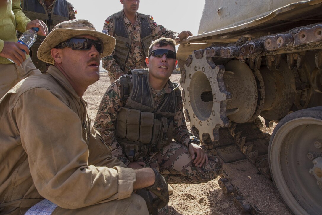 U.S. Marine Gunnery Sgt. Jonathon Griffith, ordnance maintenance chief with maintenance detachment, Combat Logistics Battalion 26, 26th Marine Expeditionary Unit (MEU), and Idaho Falls, Idaho, native, assesses damage to a Jordanian Armed Force’s M88A1 during Exercise Eager Lion 2013 in Al Quweira, Jordan, June 13, 2013. Exercise Eager Lion 2013 is an annual multinational exercise designed to strengthen military-to-military relationships and enhance security and stability in the region. The 26th MEU is a Marine Air-Ground Task Force forward-deployed to the U.S. 5th Fleet area of responsibility aboard the Kearsarge Amphibious Ready Group serving as a sea-based, expeditionary crisis response force capable of conducting amphibious operations across the full range of military operations. (U.S. Marine Corps photo by Cpl. Kyle N. Runnels/Released)
