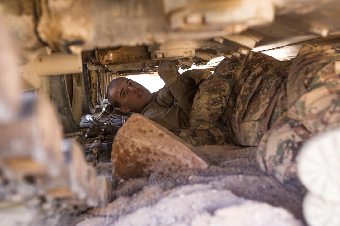 U.S. Marine Cpl. Joshua D. Knese, a St. Louis, native, and an M88A2 Hercules operator assigned to maintenance detachment, Combat Logistics Battalion26, 26th Marine Expeditionary Unit (MEU), helps a member of the Jordanian Armed Forces replace damaged track blocks on their M88A1 during Exercise Eager Lion 2013 in Al Quweira, Jordan, June 13, 2013. Exercise Eager Lion 2013 is an annual multinational exercise designed to strengthen military-to-military relationships and enhance security and stability in the region. The 26th MEU is a Marine Air-Ground Task Force forward-deployed to the U.S. 5th Fleet area of responsibility aboard the Kearsarge Amphibious Ready Group serving as a sea-based, expeditionary crisis response force capable of conducting amphibious operations across the full range of military operations. (U.S. Marine Corps photo by Cpl. Kyle N. Runnels/Released)