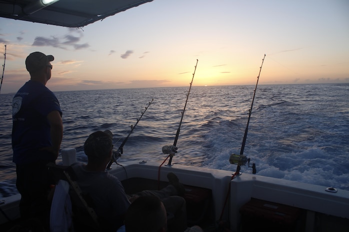 Marines patiently wait for a bite as the sun rises June 9 in the East China Sea during the 9th annual Sam’s Cup International Billfish Tournament off the coast of Okinawa. The tournament officials award the teams for the heaviest fish and the heaviest total catches with a trophy and bragging rights for the year. The Marines are with 3rd Maintenance Battalion, Combat Logistics Regiment 35, 3rd Marine Logistics Group, III Marine Expeditionary Force.