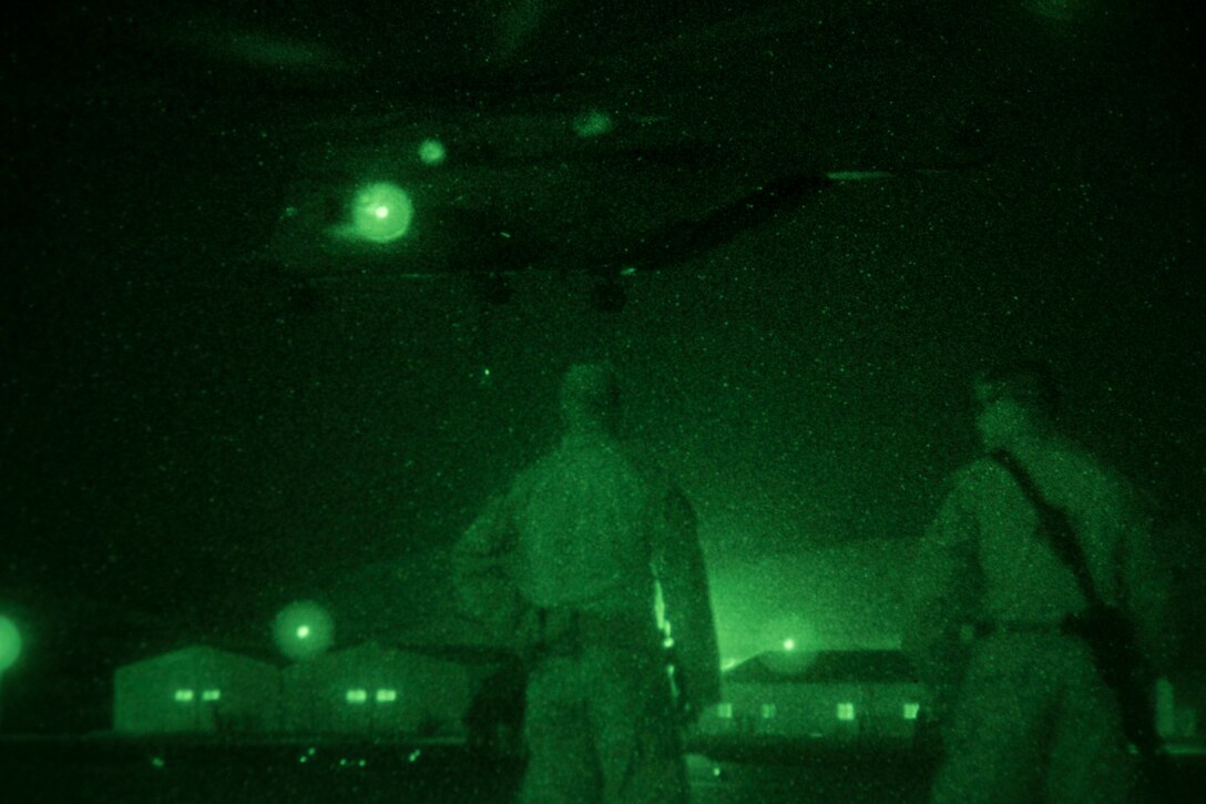A helicopter suspension team assigned to landing support detachment, Combat Logistics Battalion 26, 26th Marine Expeditionary Unit (MEU), prepares to attach a quadcon to a CH-53E Super Stallion assigned to Marine Medium Tiltrotor Squadron (VMM) 266 (Reinforced), 26th MEU, during Exercise Eager Lion 2013 in Al Quweira, Jordan, June 13, 2013. Exercise Eager Lion 2013 is an annual multinational exercise designed to strengthen military-to-military relationships and enhance security and stability in the region. The 26th MEU is a Marine Air-Ground Task Force forward-deployed to the U.S. 5th Fleet area of responsibility aboard the Kearsarge Amphibious Ready Group serving as a sea-based, expeditionary crisis response force capable of conducting amphibious operations across the full range of military operations. (U.S. Marine Corps photo by Cpl. Kyle N. Runnels/Released)
