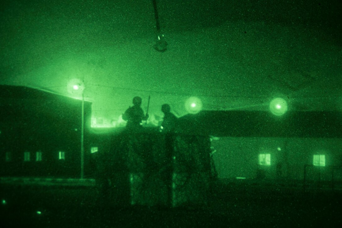 A helicopter suspension team assigned to landing support detachment, Combat Logistics Battalion 26, 26th Marine Expeditionary Unit (MEU), prepares to attach a quadcon to a CH-53E Super Stallion assigned to Marine Medium Tiltrotor Squadron (VMM) 266 (Reinforced), 26th MEU, during Exercise Eager Lion 2013 in Al Quweira, Jordan, June 13, 2013. Exercise Eager Lion 2013 is an annual multinational exercise designed to strengthen military-to-military relationships and enhance security and stability in the region. The 26th MEU is a Marine Air-Ground Task Force forward-deployed to the U.S. 5th Fleet area of responsibility aboard the Kearsarge Amphibious Ready Group serving as a sea-based, expeditionary crisis response force capable of conducting amphibious operations across the full range of military operations. (U.S. Marine Corps photo by Cpl. Kyle N. Runnels/Released)
