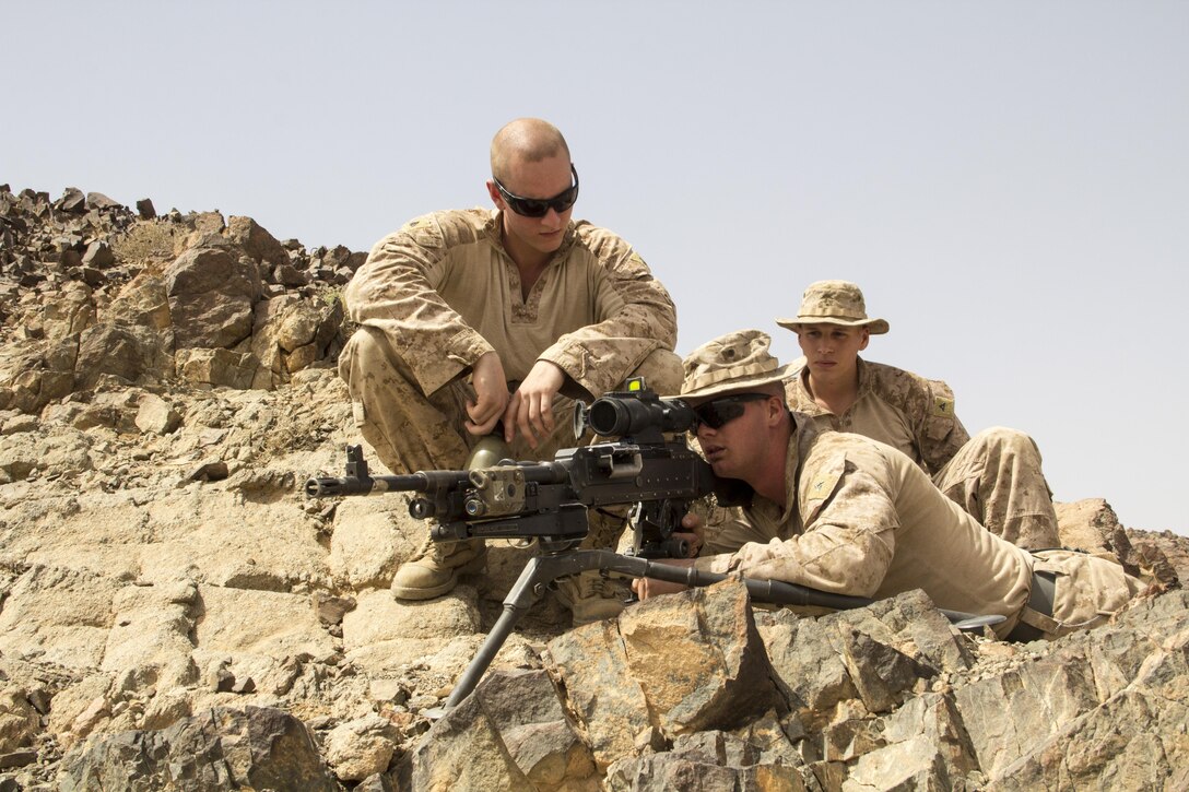 U.S. Marines assigned to Lima Company, Battalion Landing Team 3/2, 26th Marine Expeditionary Unit (MEU), gauge distances of targets using M240B machine guns while training in Al Quweira, Jordan, during Exercise Eager Lion 13, June 9, 2013. Exercise Eager Lion 2013 is an annual, multinational exercise designed to strengthen military-to-military relationships and enhance security and stability in the region by responding to realistic, modern-day security scenarios. The 26th MEU is a Marine Air-Ground Task Force forward-deployed to the U.S. 5th Fleet area of responsibility aboard the Kearsarge Amphibious Ready Group serving as a sea-based, expeditionary crisis response force capable of conducting amphibious operations across the full range of military operations. (U.S. Marine Corps photograph by Lance Cpl. Juanenrique Owings, 26th MEU Combat Camera/Released)