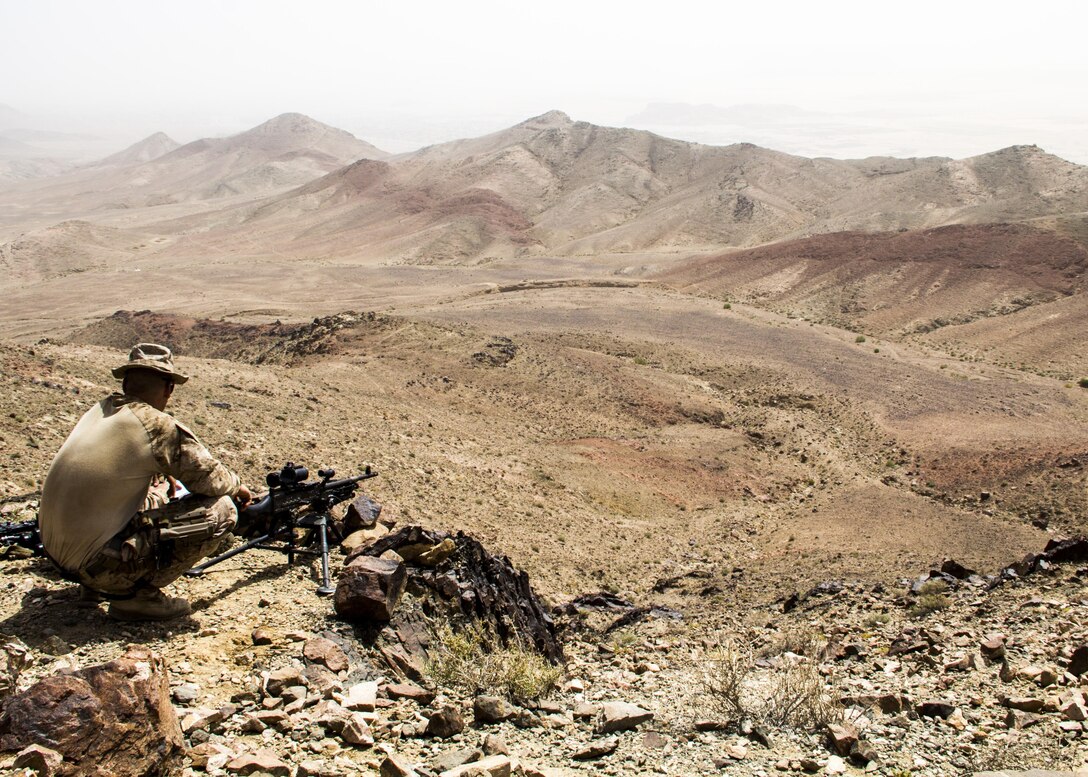 U.S. Marines assigned to Lima Company, Battalion Landing Team 3/2, 26th Marine Expeditionary Unit (MEU), gauge distances of targets using M240B machine guns while training in Al Quweira, Jordan, during Exercise Eager Lion 13, June 9, 2013. Exercise Eager Lion 2013 is an annual, multinational exercise designed to strengthen military-to-military relationships and enhance security and stability in the region by responding to realistic, modern-day security scenarios. The 26th MEU is a Marine Air-Ground Task Force forward-deployed to the U.S. 5th Fleet area of responsibility aboard the Kearsarge Amphibious Ready Group serving as a sea-based, expeditionary crisis response force capable of conducting amphibious operations across the full range of military operations. (U.S. Marine Corps photograph by Lance Cpl. Juanenrique Owings, 26th MEU Combat Camera/Released)