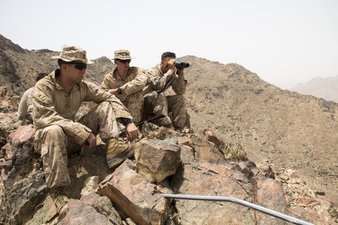 U.S. Marines assigned to Lima Company, Battalion Landing Team 3/2, 26th Marine Expeditionary Unit (MEU), gauge distances of targets while training in Al Quweira, Jordan, during Exercise Eager Lion 13, June 9, 2013. Exercise Eager Lion 2013 is an annual, multinational exercise designed to strengthen military-to-military relationships and enhance security and stability in the region by responding to realistic, modern-day security scenarios. The 26th MEU is a Marine Air-Ground Task Force forward-deployed to the U.S. 5th Fleet area of responsibility aboard the Kearsarge Amphibious Ready Group serving as a sea-based, expeditionary crisis response force capable of conducting amphibious operations across the full range of military operations. (U.S. Marine Corps photograph by Lance Cpl. Juanenrique Owings, 26th MEU Combat Camera/ Released)