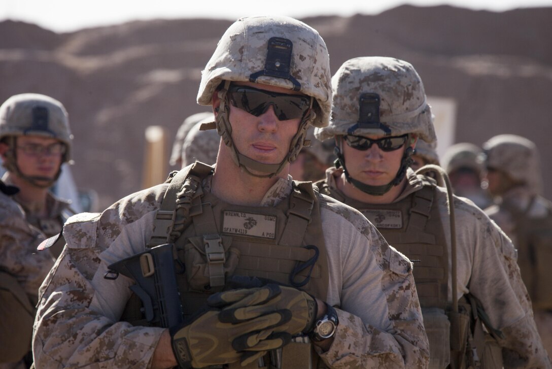 U.S. Marine Corps 1st Lt. Timothy Wrenn, an advisor assigned to the Afghan National Civil Order Police Kandak 1, listens to a safety brief before conducting a shooting package on Camp Leatherneck, Helmand province, Afghanistan, June 8, 2013. The Marines conducted the training to prepare them for situations they may encounter while conducting missions in support of Operation Enduring Freedom. (U.S. Marine Corps photo by Staff Sgt. Ezekiel R. Kitandwe/Released)