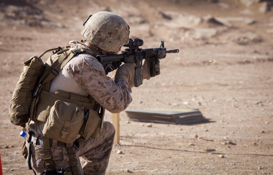 U.S. Marine Corps Capt. James Marek, an advisor assigned to the Afghan National Civil Order Police Kandak 1, engages multiple targets during a live fire shooting package on Camp Leatherneck, Helmand province, Afghanistan, June 8, 2013. The Marines conducted the training to prepare them for situations they may encounter while conducting missions in support of Operation Enduring Freedom. (U.S. Marine Corps photo by Staff Sgt. Ezekiel R. Kitandwe/Released)