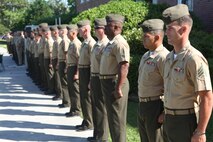 Marines and sailors with 2nd Marine Logistics Group stand at attention during the playing of the “Marines’ Hymn” during a retirement ceremony aboard Camp Lejeune, N.C., June 14, 2013. Staff Sgt. Clements, along with her husband Gunnery Sgt. Ryan P. Clements, retired from the Marine Corps together after 20 years of service.