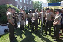 Marines with 2nd Marine Logistics Group present Sgt. Robin R. Clements along with her husband, Gunnery Sgt. Ryan P. Clements, a gift from their colleagues during a retirement ceremony aboard Camp Lejeune, N.C., June 14, 2013. Gunnery Sgt. and Staff Sgt. Clements both enlisted in the early 90s serving, 20 years in the Marine Corps. 