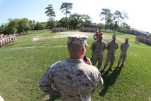 Brig. Gen. Edward D. Banta (center), the commanding general of 2nd Marine Logistics Group, congratulates 8th Engineer Support Battalion, 2nd MLG after an awards presentation for the American Petroleum Institute Award for excellence in fuel management aboard Camp Lejeune, N.C., June 13, 2013.  Bulk Fuel Company, 8th ESB competed against tactical bulk fuel companies throughout the Department of Defense, earning them the award for runner-up as tactical bulk fuel unit of the year. 