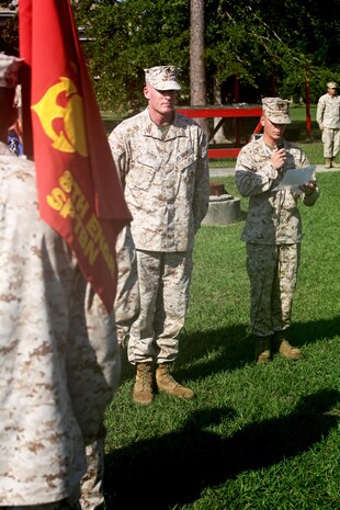 Brig. Gen. Edward D. Banta (center), the commanding general of 2nd Marine Logistics Group, awaits to present Bulk Fuel Company, 8th Engineer Support Battalion, 2nd MLG the American Petroleum Institute Award for excellence in fuel management aboard Camp Lejeune, N.C., June 13, 2013.  The award is presented to the best bulk fuel units for their ability to manage all fuel responsibilities. 