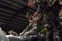 Military personnel prepare a medical patient for evacuation Wednesday, Sept. 10, 2008 from Corpus Christi, Texas to a medical facility in Dallas as Hurricane Ike approaches the Texas Gulf Coast. U.S. Northern Command is supporting federal, state and local Hurricane Ike response efforts in Texas, and aeromedical evacuation capabilities remain on alert pending FEMA requests for assistance.