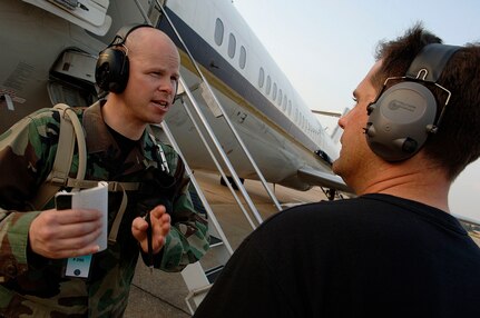 U.S. Air Force Master Sgt. Shawn Showman, 615th Contingency Response Wing, Travis Air Force Base, CA, speaks with Senior Master Sgt. Curtis Cookston also the 615th CRW, during civilian evacuation operations at the Louis Armstrong International Airport, New Orleans, Louisiana, Aug. 30, 2008.  MSgt. Showman is supporting the operations to evacuate civilians from New Orleans prior to Hurricane Gustav making landfall.  