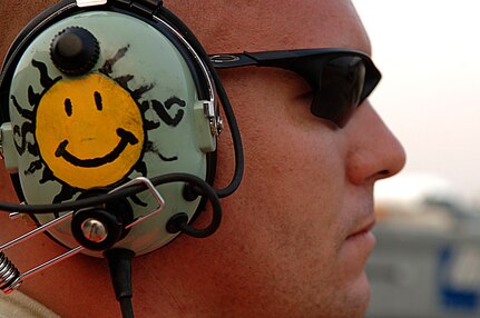 A member of the 615th Contingency Response Wing, Travis Air Force Base, CA, prepares to guide an aircraft out of it blocks at the Louis Armstrong International Airport, New Orleans, Louisiana, Aug. 30, 2008.  Members of the 615th supporting the operations to evacuate civilians from New Orleans prior to Hurricane Gustav making landfall.  