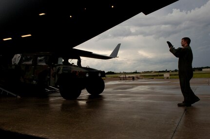 Air Force Staff Sgt. Dustin Centerbury, C-17 loadmaster from Altus Air Force Base, loads a HUMVEE onto the aircraft at MacDill AFB. The HUMVEEs and medical supplies were deployed to Beaumont, Texas, to assist in preparation for hurricane Gustav evacuations. 