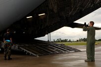 Staff Sgt. Dustin Centerbury, C-17 loadmaster from Altus Air Force Base, loads a HUMVEE onto the aircraft at MacDill AFB. The HUMVEEs and medical supplies were deployed to Beaumont, Texas, to assist in preparation for hurricane Gustav evacuations. 