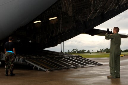 Staff Sgt. Dustin Centerbury, C-17 loadmaster from Altus Air Force Base, loads a HUMVEE onto the aircraft at MacDill AFB. The HUMVEEs and medical supplies were deployed to Beaumont, Texas, to assist in preparation for hurricane Gustav evacuations. 