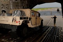 Staff Sgt. Dustin Canterbury, a loadmaster from Altus Air Force Base, Oklahoma, prepare to load HUMVEEs and  medical supplies onto a C-17 Globemaster. The supplies are headed to Beaumont, Texas in preparation for hurricane Gustav relief efforts.
