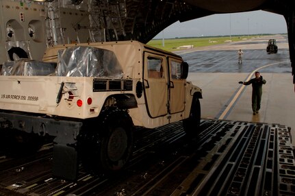 Staff Sgt. Dustin Canterbury, a loadmaster from Altus Air Force Base, Oklahoma, prepare to load HUMVEEs and  medical supplies onto a C-17 Globemaster. The supplies are headed to Beaumont, Texas in preparation for hurricane Gustav relief efforts.
