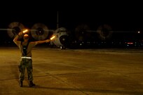 Master Sgt. Kevin Moss, Texas Air National Guard, marshals a C-130 Hercules at Southeast Texas regional airport in Beaumont, Texas. The C-130 evacuated more than 150 patients from nursing homes and extended care facilities from in and around the area in preperation for hurricane Gustav's arrival.