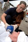 A member of the Emergency Medical Service Strike Team uses a respirator on a patient prior to loading him onto a C-17 Globemaster III from McGuire Air Force Base, NJ, at the Lakefront Airport in New Orleans, LA, Aug. 31, 2008.  Members of the 199th are helping to evacuating civilian out of New Orleans prior to Hurricane Gustav making landfall.  