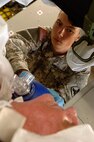 Army Private First Class Kasey Preuet of the 199th Foxtrot Support Company, Lake Charles, Louisiana National Guard, uses a reporator to give oxygen to a patient aboard a C-17 Globemaster III from McGuire AFB, NJ, at the Lakefront Airport in New Orleans, LA, Aug.31, 2008.  Members of the 199th are evacuating civilian out of New Orleans prior to Hurricane Gustav making landfall.  